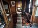 Carpeted staircase leads to upper level featuring wood walls and trim at 2731 Delaware St, Anderson, IN 46016