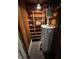 Compact utility room includes shelving and a hot water tank for efficient home management at 2731 Delaware St, Anderson, IN 46016