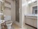 Cozy bathroom featuring a shower, toilet, and vanity with sink at 32 W Northeast Ct, Shelbyville, IN 46176