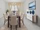 Elegant dining room featuring a table set for six, stylish sideboard and a bright window view at 32 W Northeast Ct, Shelbyville, IN 46176