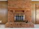 Close-up of brick fireplace, highlighting its detailed design and classic charm in the living space at 32 W Northeast Ct, Shelbyville, IN 46176