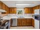 Functional kitchen with stainless steel appliances, wood cabinets, and ample counter space at 32 W Northeast Ct, Shelbyville, IN 46176