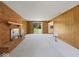 Spacious living room with brick fireplace and sliding glass door to the backyard at 32 W Northeast Ct, Shelbyville, IN 46176