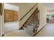 Carpeted stairway leading to the upper level, with a glimpse of the living room at 32 W Northeast Ct, Shelbyville, IN 46176
