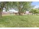 Large backyard with mature trees, perfect for outdoor activities and relaxation at 3224 Prague Rd, Indianapolis, IN 46227