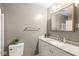 Bathroom featuring a vanity with granite countertop, and a large mirror, blending style with functionality at 3224 Prague Rd, Indianapolis, IN 46227