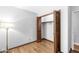 Bedroom features hardwood floors, closet, and a floor lamp, making it cozy and functional at 3224 Prague Rd, Indianapolis, IN 46227