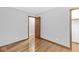 Neutral bedroom featuring hardwood floors and a closet, with a window that provides lots of natural light at 3224 Prague Rd, Indianapolis, IN 46227