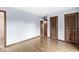 Cozy bedroom features hardwood floors, neutral paint, and easy access to an attached bathroom at 3224 Prague Rd, Indianapolis, IN 46227