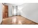 Cozy bedroom features hardwood floors and a window letting in natural light and ample closet space at 3224 Prague Rd, Indianapolis, IN 46227