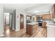 Updated kitchen with an island, wood cabinets, and stainless steel appliances at 3224 Prague Rd, Indianapolis, IN 46227