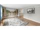 Cozy living room with hardwood floors, mural, and decorative rug at 3224 Prague Rd, Indianapolis, IN 46227