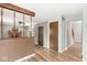 Transitional living room with hardwood floors, brick fireplace, and natural light at 3224 Prague Rd, Indianapolis, IN 46227