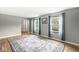 Inviting living room featuring hardwood floors, area rug, and natural light from the windows at 3224 Prague Rd, Indianapolis, IN 46227