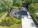 Overhead shot showcasing a well-maintained ranch home with mature trees and ample parking at 3777 W State Road 234, McCordsville, IN 46055