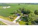 Picturesque aerial view showcasing a home with verdant fields in the background at 3777 W State Road 234, McCordsville, IN 46055