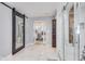 Bathroom featuring a large mirror, glass shower, and light marble floors at 3777 W State Road 234, McCordsville, IN 46055