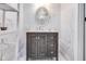 Bathroom with a marble vanity and an oval mirror with elegant lighting at 3777 W State Road 234, McCordsville, IN 46055