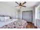 Relaxing bedroom with sliding closet door and hardwood floors at 3777 W State Road 234, McCordsville, IN 46055