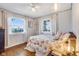 Charming bedroom with hardwood floors and bright windows at 3777 W State Road 234, McCordsville, IN 46055