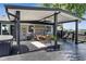 Covered deck with a hot tub, ceiling fan, seating, and a view of the backyard at 3777 W State Road 234, McCordsville, IN 46055