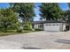 Well-maintained ranch house featuring a brick exterior, an attached two-car garage, and established trees at 3777 W State Road 234, McCordsville, IN 46055