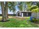 View of the detached garage with an American flag in the private backyard at 3777 W State Road 234, McCordsville, IN 46055
