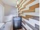 Clean laundry room features modern washer/dryer, accent wall, and vinyl floors at 3777 W State Road 234, McCordsville, IN 46055