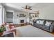 Cozy living room featuring hardwood floors, a fireplace, neutral walls, and a comfortable seating area at 3777 W State Road 234, McCordsville, IN 46055