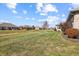 Spacious backyard featuring a well-manicured lawn with an open view of neighboring houses at 3784 Mansfield Dr, Brownsburg, IN 46112