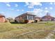 A view of the property's backyard, featuring well-maintained grass and a brick exterior at 3784 Mansfield Dr, Brownsburg, IN 46112