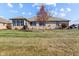 Large backyard with a well-manicured lawn and mature tree at 3784 Mansfield Dr, Brownsburg, IN 46112