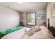 Cozy bedroom features four poster bed, wood floors, and a bright window at 3784 Mansfield Dr, Brownsburg, IN 46112