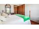 A well-lit bedroom featuring neutral walls, hardwood flooring, and closet space at 3784 Mansfield Dr, Brownsburg, IN 46112