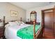 Bedroom features four-poster bed, wood floors, and a dresser with mirror at 3784 Mansfield Dr, Brownsburg, IN 46112