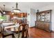 Inviting dining room with hardwood floors adjacent to kitchen with stainless steel appliances at 3784 Mansfield Dr, Brownsburg, IN 46112
