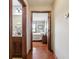 Hallway view into bathroom with a granite countertop and bedroom with window and sitting chair at 3784 Mansfield Dr, Brownsburg, IN 46112
