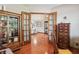Inviting hallway with hardwood floors and french doors leading to the spacious living room at 3784 Mansfield Dr, Brownsburg, IN 46112
