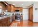 Well-appointed kitchen with stainless steel appliances, wood cabinetry, and granite countertops at 3784 Mansfield Dr, Brownsburg, IN 46112
