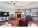 Comfortable living room featuring a fireplace, a TV, and cozy seating area with a great view at 3784 Mansfield Dr, Brownsburg, IN 46112