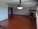 Large living room featuring a brick fireplace and hardwood floors at 3784 Mansfield Dr, Brownsburg, IN 46112