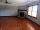 Large living room featuring a brick fireplace and hardwood floors at 3784 Mansfield Dr, Brownsburg, IN 46112
