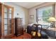 An office with a large window providing natural light and wood floors at 3784 Mansfield Dr, Brownsburg, IN 46112
