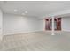 Spacious finished basement with neutral carpeting, recessed lighting and decorative wood shelving at 4150 Huntsman Dr, Zionsville, IN 46077