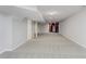 Finished basement area with recessed lighting, neutral carpet, and a decorative wood shelf at 4150 Huntsman Dr, Zionsville, IN 46077