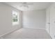 Neutral bedroom with a large window providing natural light, plush carpet, and new paint at 4150 Huntsman Dr, Zionsville, IN 46077