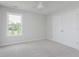 Bright carpeted bedroom with a window view, closet, and new paint at 4150 Huntsman Dr, Zionsville, IN 46077