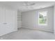 Neutral bedroom with a closet, shelves, new carpet, and lots of natural light at 4150 Huntsman Dr, Zionsville, IN 46077