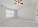 Spacious bedroom with neutral walls, carpet, ceiling fan, and natural light at 4150 Huntsman Dr, Zionsville, IN 46077