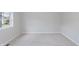 Neutral bedroom with a window, carpet, and neutral walls at 4150 Huntsman Dr, Zionsville, IN 46077